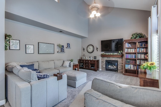 1966 Decatur Ave, Clovis, CA 93611 - living room with carpet floors, a ceiling fan, and a fireplace
