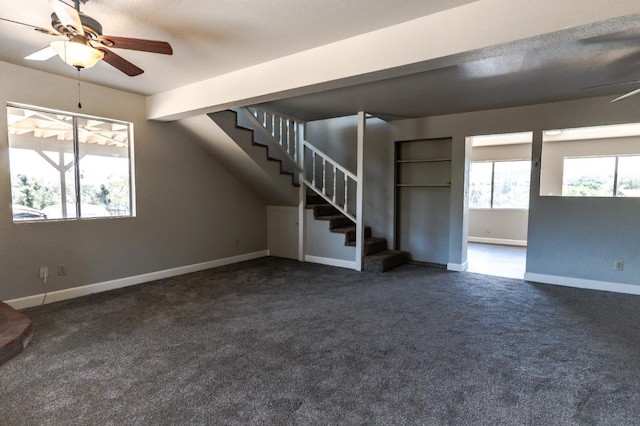 42560 Ranger Circle Way, Coarsegold, CA 93614 - unfurnished living room with ceiling fan, dark carpet, and stairs