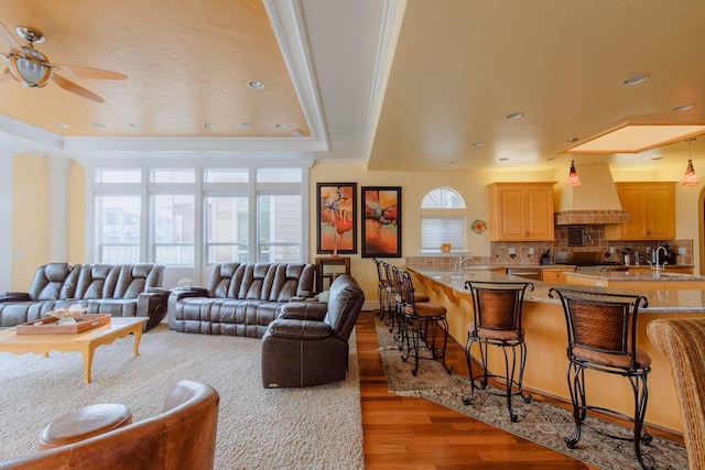 325 Juanita Ave, Oceano, CA 93445 - living area featuring wood finished floors, a ceiling fan, recessed lighting, a raised ceiling, and ornamental molding