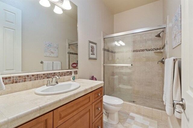 10615 E Landmark Way, Clovis, CA 93619 - bathroom with vanity, a stall shower, tasteful backsplash, and tile patterned flooring