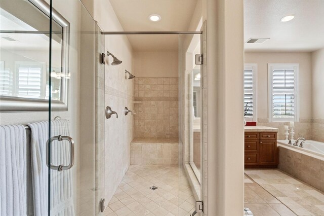 10615 E Landmark Way, Clovis, CA 93619 - bathroom with tile patterned flooring, vanity, a shower stall, a bath, and recessed lighting