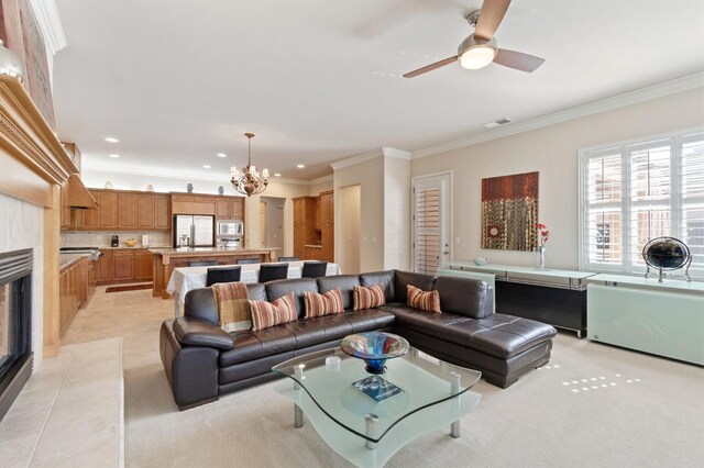 10615 E Landmark Way, Clovis, CA 93619 - living room with crown molding, recessed lighting, a chandelier, ceiling fan, and light tile patterned flooring