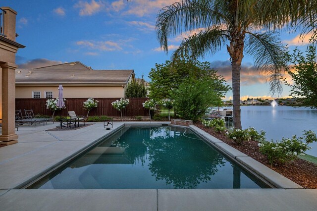 10615 E Landmark Way, Clovis, CA 93619 - view of pool featuring a patio, a fenced backyard, and a water view