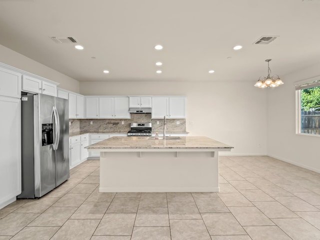 3433 Descanso Ave, Clovis, CA 93619 - kitchen with appliances with stainless steel finishes, under cabinet range hood, backsplash, white cabinetry, and recessed lighting