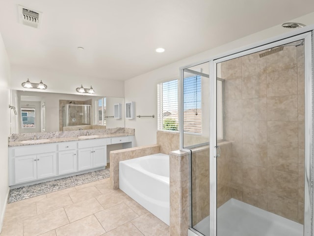 3433 Descanso Ave, Clovis, CA 93619 - full bath with a garden tub, double vanity, a stall shower, tile patterned floors, and recessed lighting