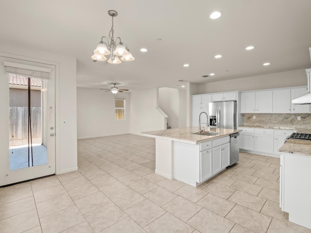 3433 Descanso Ave, Clovis, CA 93619 - kitchen with appliances with stainless steel finishes, light tile patterned floors, a ceiling fan, a chandelier, and recessed lighting