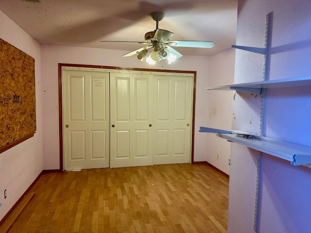 13308 Hood Ave, Hanford, CA 93230 - unfurnished bedroom featuring light wood-style floors, a closet, and a ceiling fan