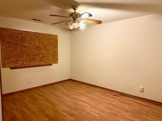 13308 Hood Ave, Hanford, CA 93230 - empty room featuring light wood-style floors and a ceiling fan