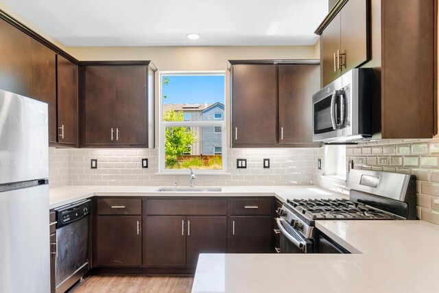 434 Blythewood Pl, Santa Rosa, CA 95407 - kitchen with stainless steel appliances, dark brown cabinetry, light countertops, and recessed lighting