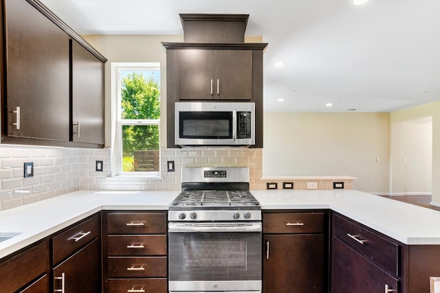 434 Blythewood Pl, Santa Rosa, CA 95407 - kitchen with appliances with stainless steel finishes, a peninsula, light countertops, dark brown cabinetry, and recessed lighting