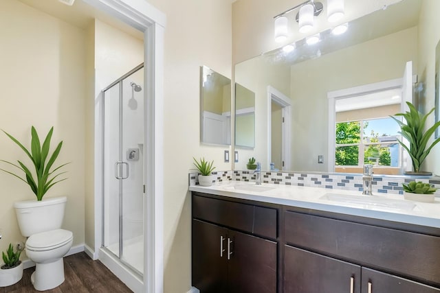 434 Blythewood Pl, Santa Rosa, CA 95407 - bathroom featuring wood finished floors, double vanity, decorative backsplash, and a shower stall