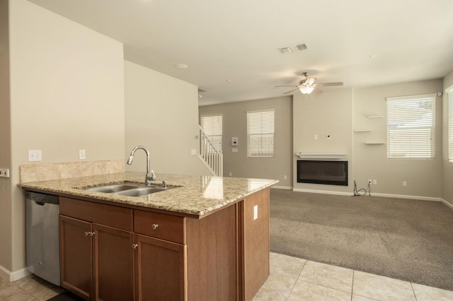 3482 Elevations Way, Clovis, CA 93619 - kitchen featuring stainless steel dishwasher, ceiling fan, a peninsula, light carpet, and light stone counters