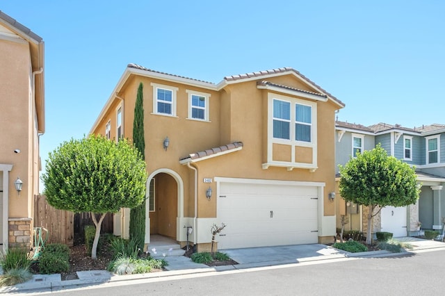 3482 Elevations Way, Clovis, CA 93619 - view of front of home featuring an attached garage, stucco siding, a tile roof, and concrete driveway