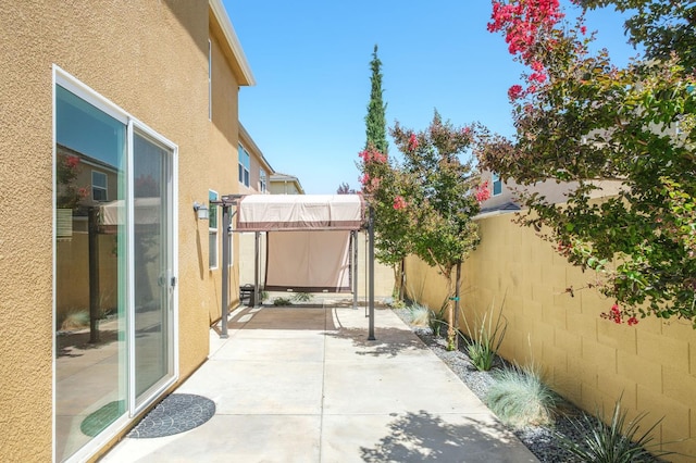 3482 Elevations Way, Clovis, CA 93619 - fenced backyard with a patio