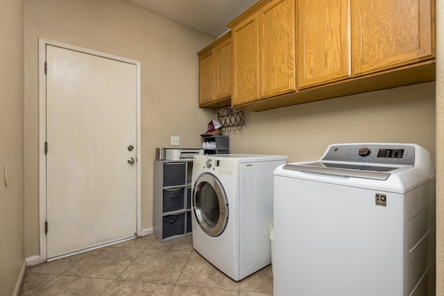 279 N Douglas, Fresno, CA 93727 - laundry room featuring cabinet space, washing machine and dryer, and light tile patterned floors