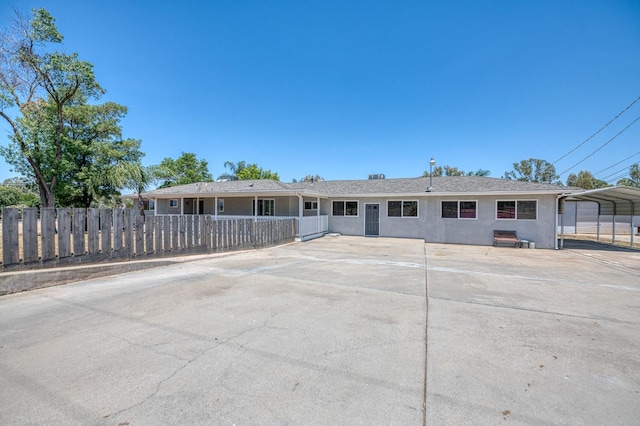 5578 E Perrin Rd, Clovis, CA 93619 - ranch-style home with stucco siding and a carport