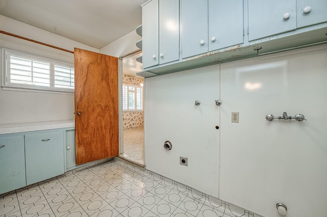 5578 E Perrin Rd, Clovis, CA 93619 - washroom featuring electric dryer hookup, cabinet space, and light floors
