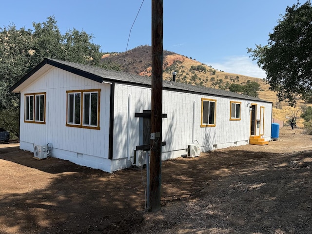 1248 Crane Ln, Yokuts Valley, CA 93675 - view of side of property featuring crawl space, a mountain view, and entry steps