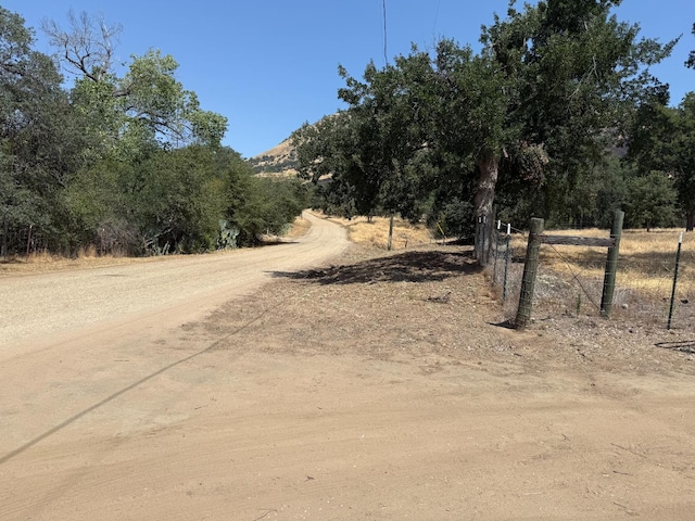 1248 Crane Ln, Yokuts Valley, CA 93675 - view of dirt / gravel road featuring a mountain view