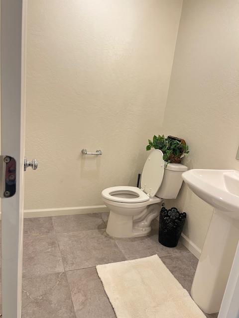 624 Suzanne Dr, Merced, CA 95348 - bathroom with toilet and tile patterned floors