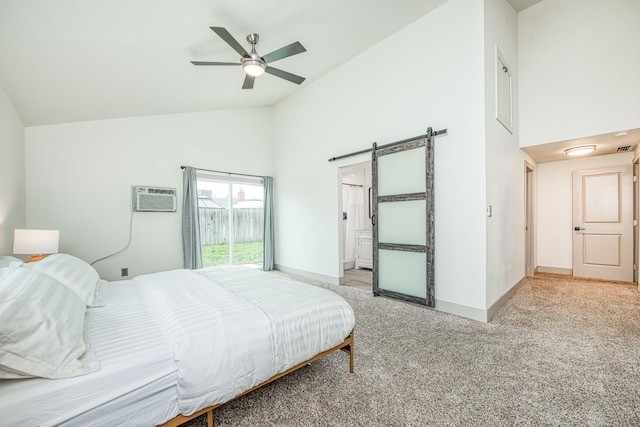254 W Sierra Ave, Clovis, CA 93612 - bedroom featuring a barn door, high vaulted ceiling, a wall mounted air conditioner, light colored carpet, and ceiling fan