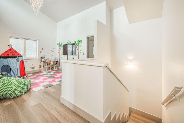 254 W Sierra Ave, Clovis, CA 93612 - playroom featuring wood finished floors and high vaulted ceiling