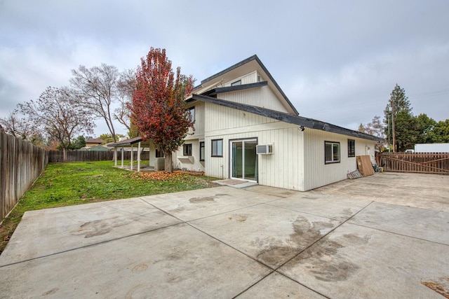 254 W Sierra Ave, Clovis, CA 93612 - rear view of property with a patio, a fenced backyard, and a wall mounted air conditioner
