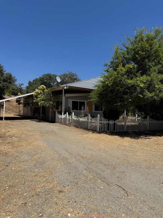50481 Sundew Rd, Yokuts Valley, CA 93675 - view of front of home featuring a fenced front yard and driveway