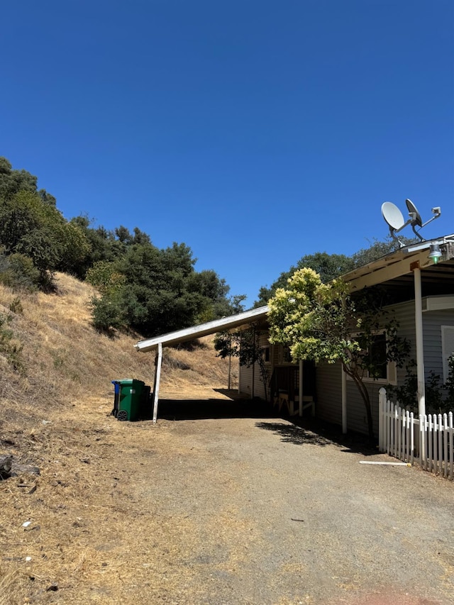 50481 Sundew Rd, Yokuts Valley, CA 93675 - view of yard with a carport and driveway