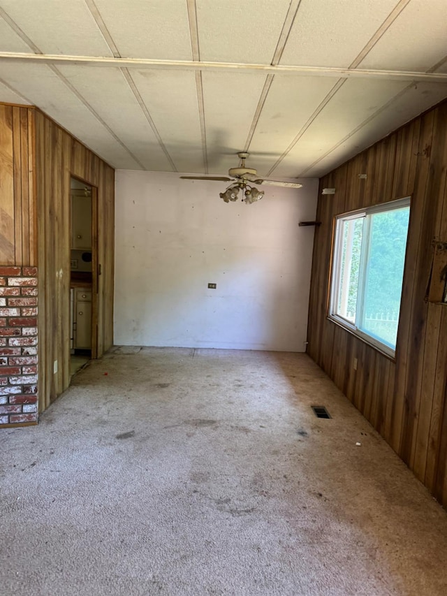 50481 Sundew Rd, Yokuts Valley, CA 93675 - carpeted empty room featuring wood walls