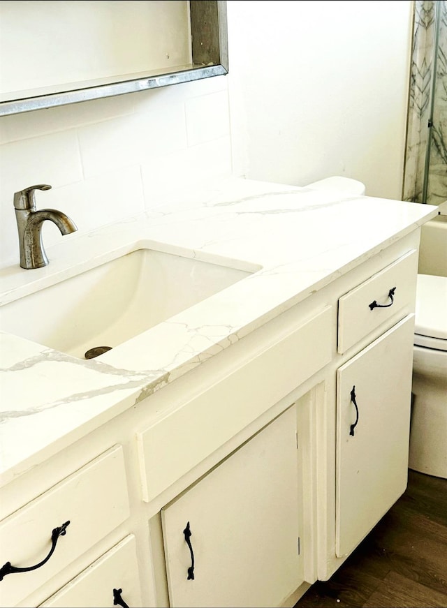 3122 Belmira Rd, Atwater, CA 95301 - full bathroom with double vanity and wood finished floors