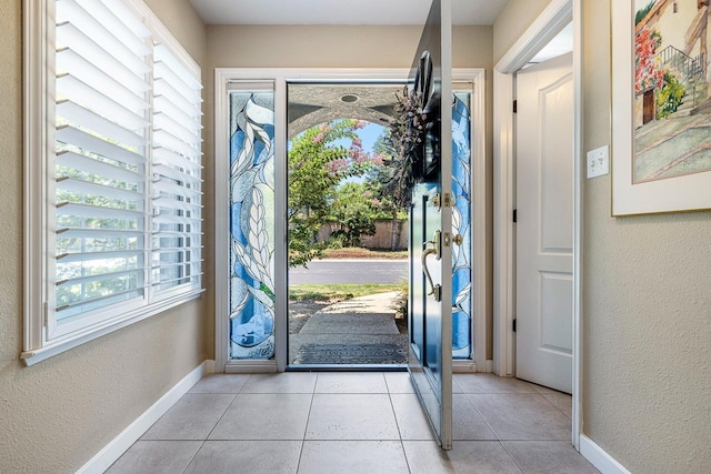 3075 W Silverhill Ln, Fresno, CA 93711 - entryway featuring a textured wall and light tile patterned floors