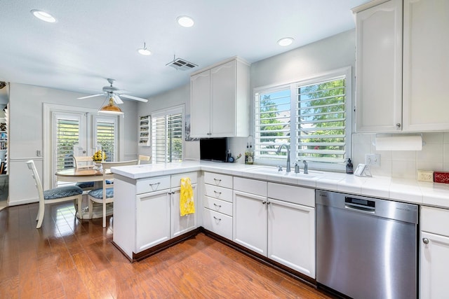 3075 W Silverhill Ln, Fresno, CA 93711 - kitchen featuring dishwasher, ceiling fan, a peninsula, white cabinets, and backsplash