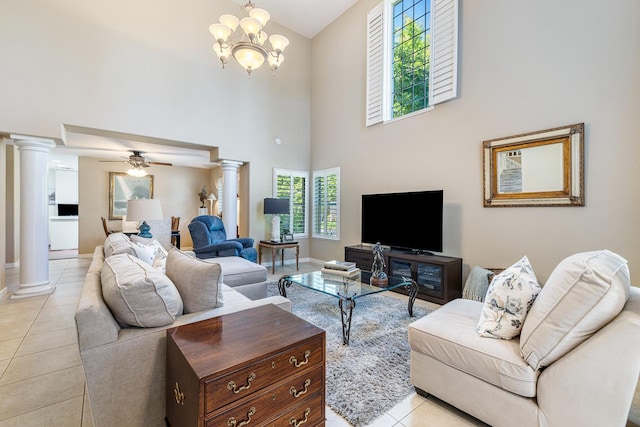 3075 W Silverhill Ln, Fresno, CA 93711 - living room with decorative columns, high vaulted ceiling, light tile patterned floors, a ceiling fan, and a chandelier