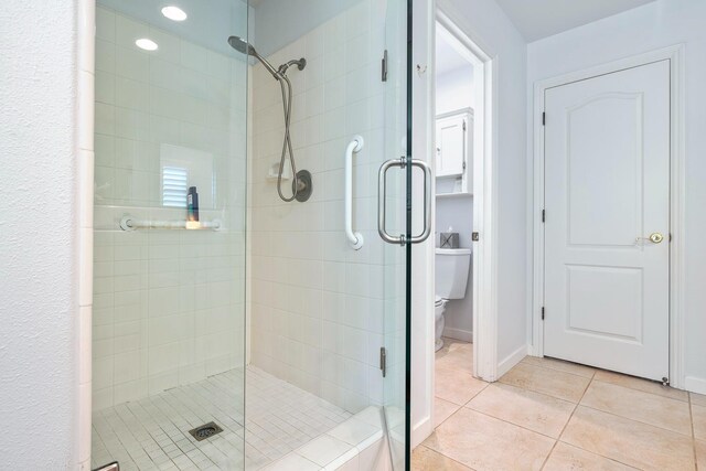 3075 W Silverhill Ln, Fresno, CA 93711 - full bathroom featuring a stall shower and tile patterned floors