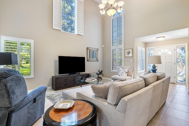 3075 W Silverhill Ln, Fresno, CA 93711 - living area with a high ceiling, light tile patterned floors, plenty of natural light, and a chandelier
