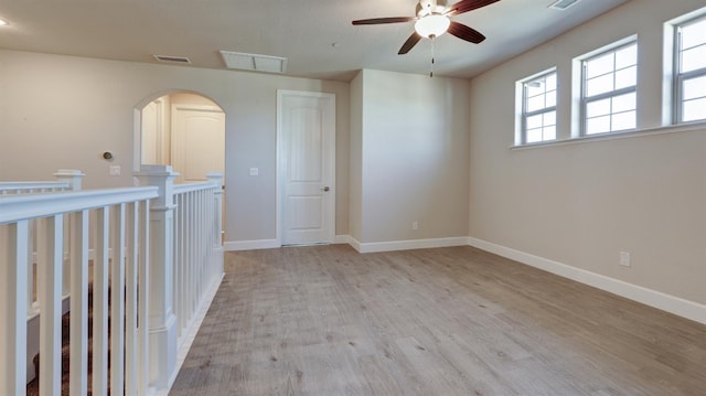 951 Talus Way S, Madera, CA 93636 - spare room with a ceiling fan, wood finished floors, and arched walkways