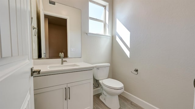 951 Talus Way S, Madera, CA 93636 - bathroom with vanity, wood finished floors, and a textured wall