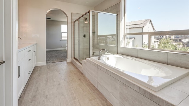 951 Talus Way S, Madera, CA 93636 - full bath featuring a garden tub, a stall shower, vanity, and wood finished floors