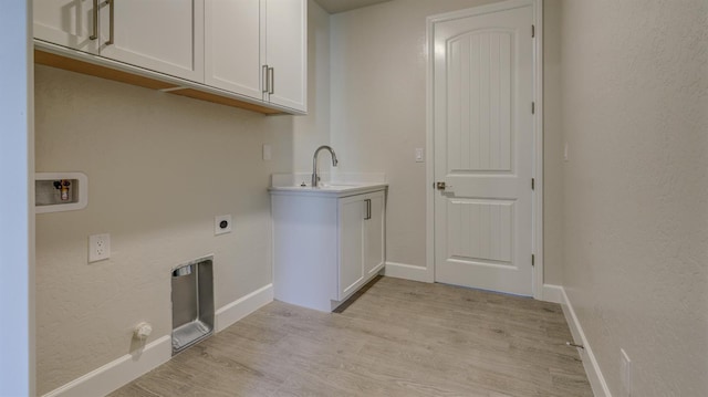 951 Talus Way S, Madera, CA 93636 - laundry room featuring cabinet space, hookup for an electric dryer, washer hookup, and light wood finished floors
