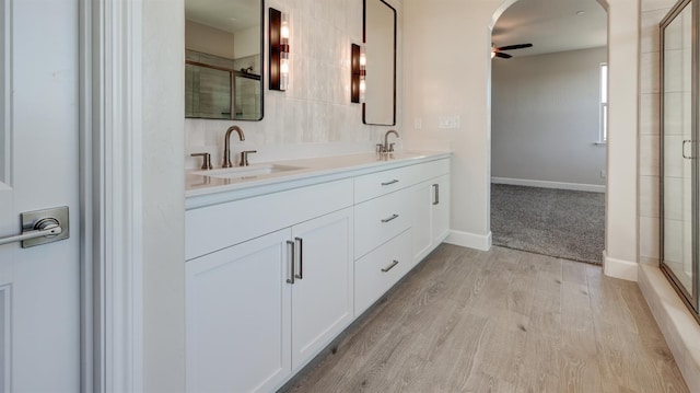 951 Talus Way S, Madera, CA 93636 - full bath with ceiling fan, wood finished floors, double vanity, and an enclosed shower