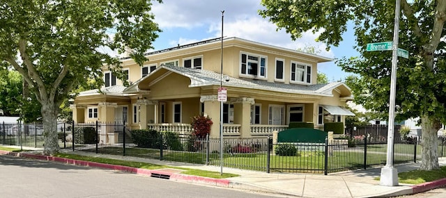 807 N Van Ness Ave, Fresno, CA 93728 - view of front facade with covered porch, stucco siding, and a fenced front yard