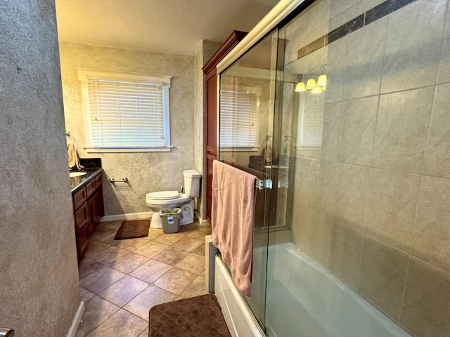 807 N Van Ness Ave, Fresno, CA 93728 - bathroom with vanity, tile patterned floors, shower / bath combination with glass door, and a textured ceiling