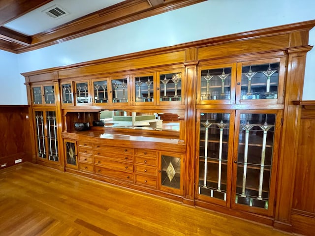 807 N Van Ness Ave, Fresno, CA 93728 - bar with ornamental molding, wood finished floors, and wainscoting