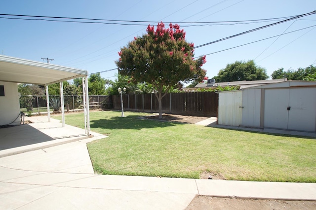 2449 S Page Ave, Fresno, CA 93725 - fenced backyard with a storage shed and a patio