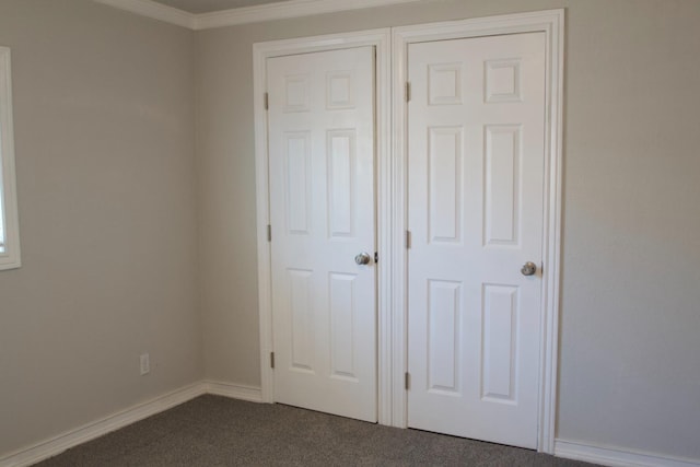 2449 S Page Ave, Fresno, CA 93725 - unfurnished bedroom featuring dark colored carpet and crown molding
