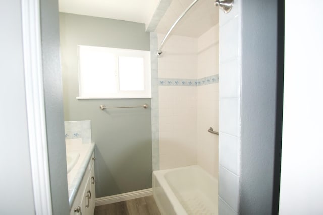 2449 S Page Ave, Fresno, CA 93725 - full bath featuring vanity, wood finished floors, and tub / shower combination