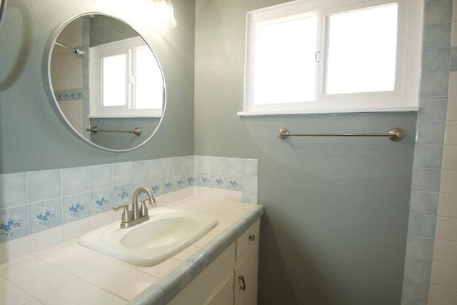 2449 S Page Ave, Fresno, CA 93725 - bathroom featuring vanity and tasteful backsplash