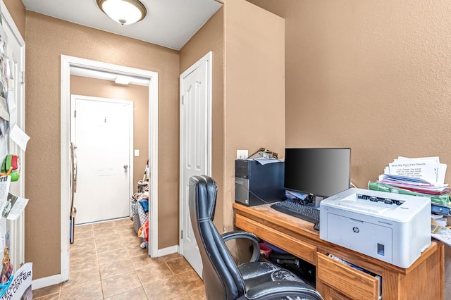 3742 Via Capitola, Madera, CA 93637 - home office with light tile patterned flooring and a textured wall