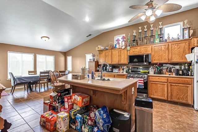 3742 Via Capitola, Madera, CA 93637 - kitchen featuring appliances with stainless steel finishes, healthy amount of natural light, lofted ceiling, light countertops, and a ceiling fan